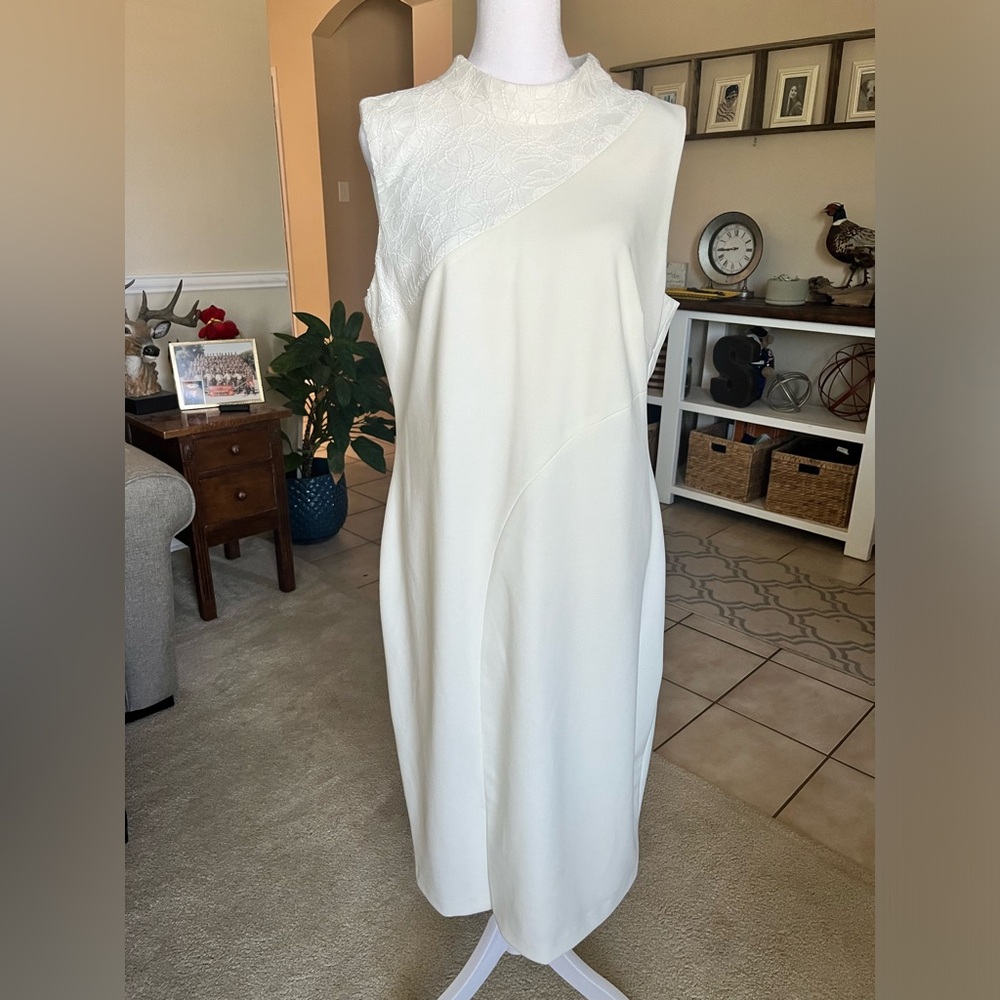 DKNY white dress. Has small stain in the back that I have not tried to get off